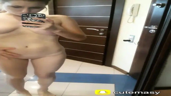 Young brunette girl shows her big boobs and sexy body