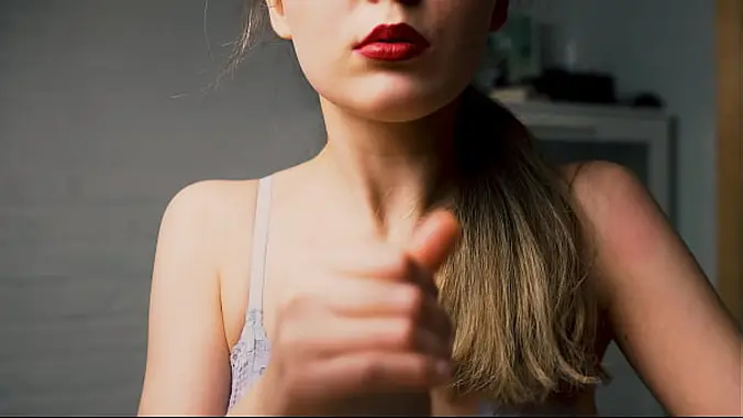 A beauty with red lips jerks off her boyfriend in close-up and brings him to the peak of pleasure.